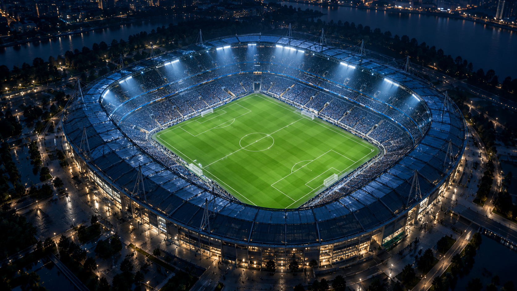 A cinematic aerial view of an illuminated football stadium
